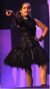 Igzidora attempting to put a curse on the people who made her change her dress