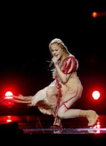 Someone had better tell her that a ball of yarn is trying to devour her.